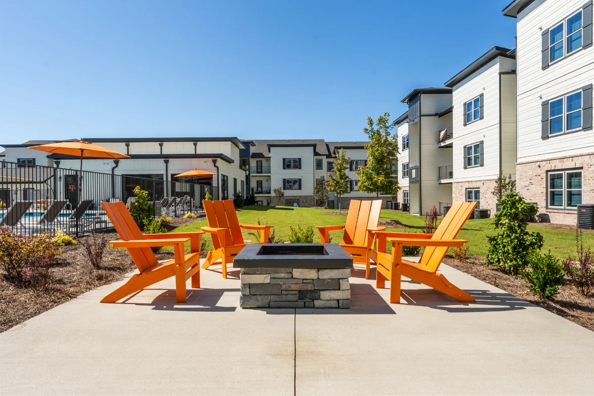 Fire pit and lounge seating at a Pointe Grand community
