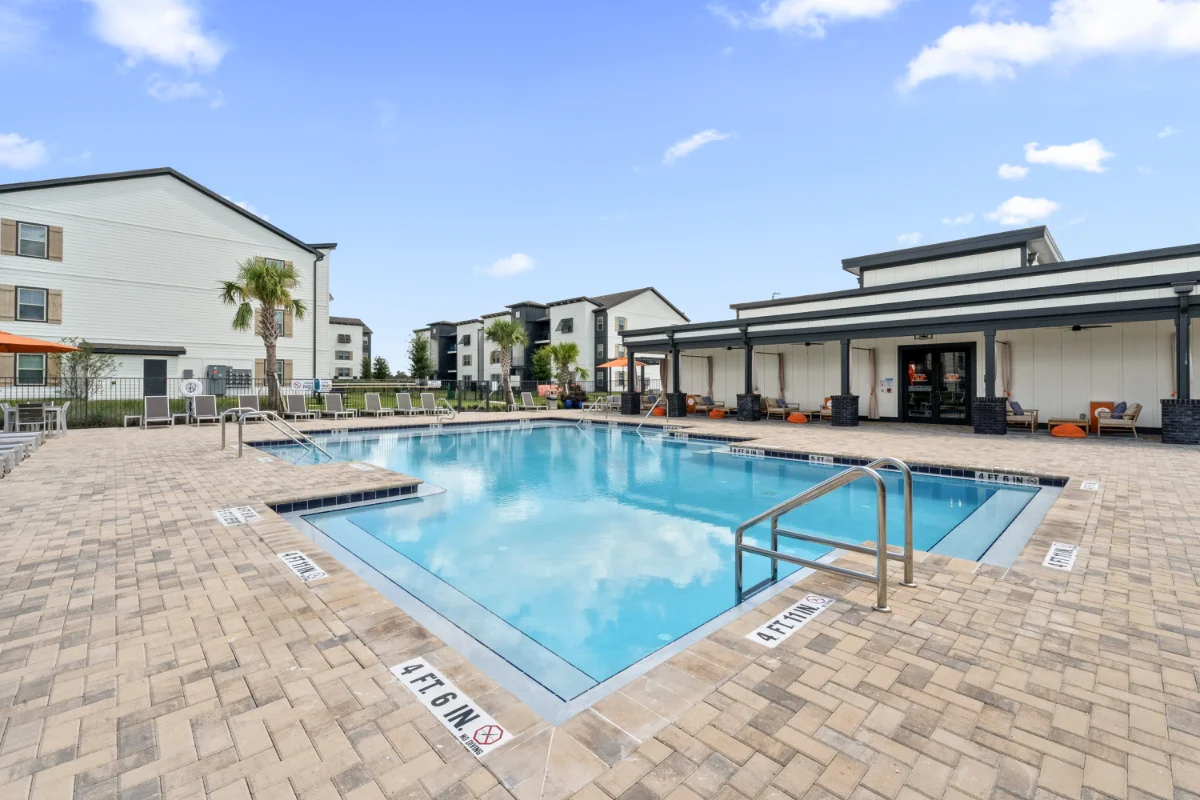 Resort-style pool and sun deck at a Pointe Grand community